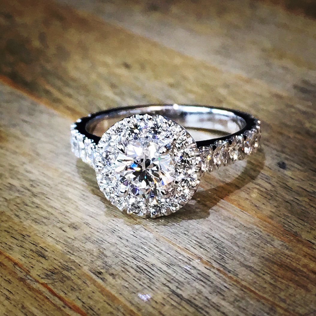 Diamond halo platinum solitaire engagement ring