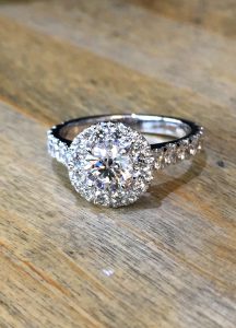 Diamond halo platinum solitaire engagement ring