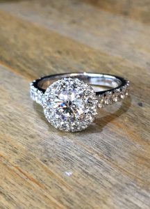 Diamond halo platinum solitaire engagement ring