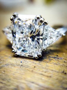 Emerald cut diamond claw set engagement ring